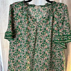 Green and pink short sleeved blouse